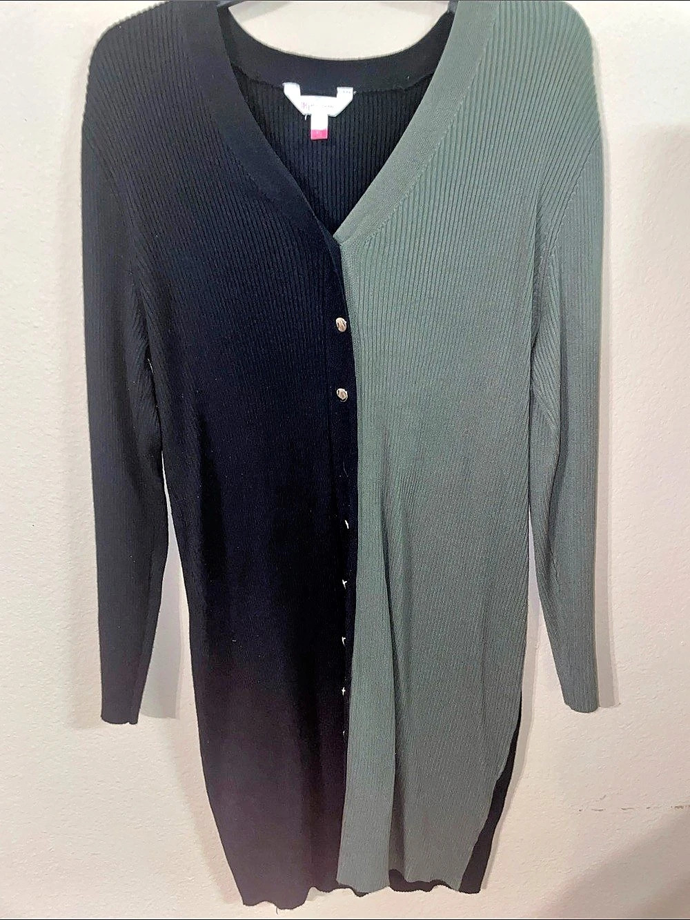 Green and black sweater dress with silver buttons